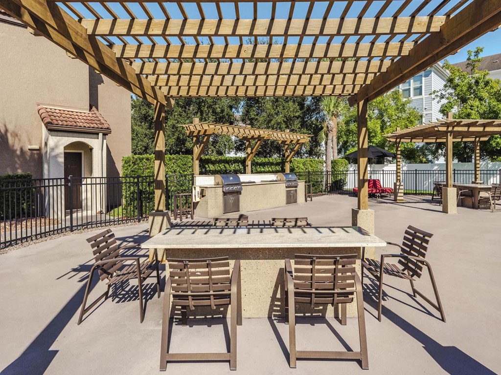 Outdoor grilling and dining pergolas with tables and seating