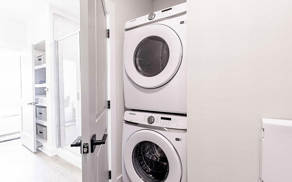 Modern bathroom with convenient in-unit washer and dryer at Novel Cary