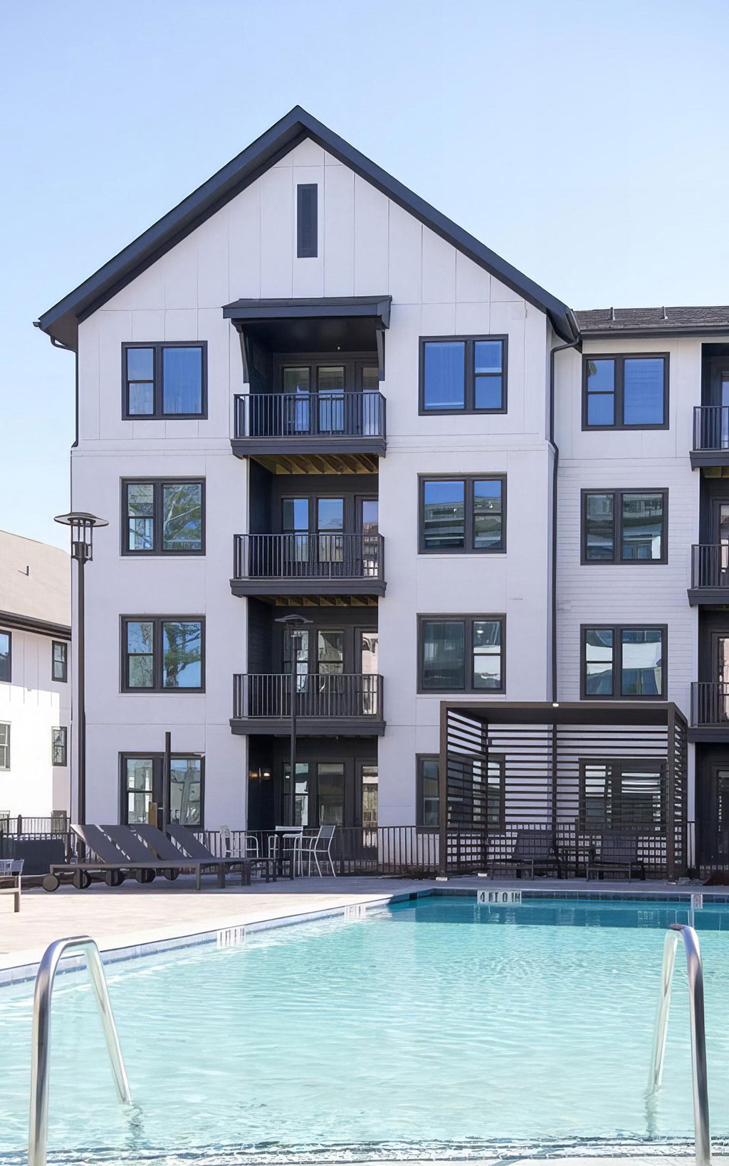 Apartments with balconies overlooking the beautiful pool area at Novel Cary
