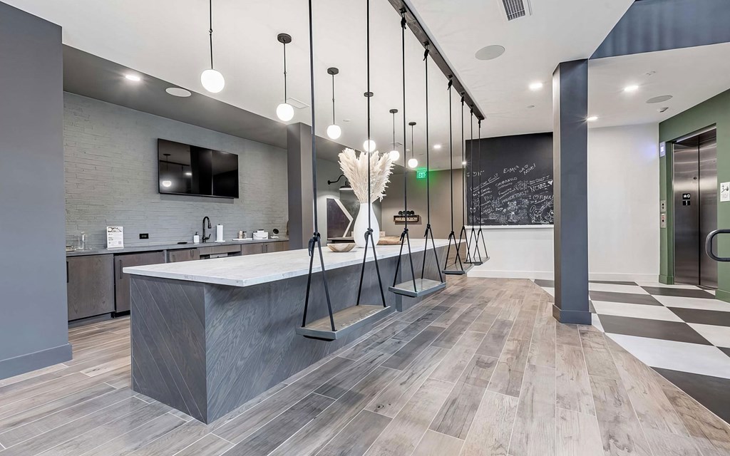 Counter area with interior swing seating, full wet bar, and chalkboard at Novel Cary