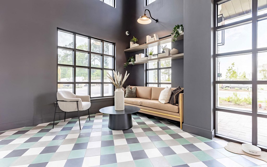 Cozy entryway with cozy seating area and pet water bowl at Novel Cary