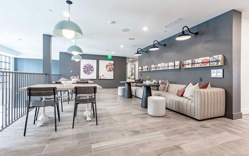 Cozy reading area with extra large sofa and magazine rack at Novel Cary