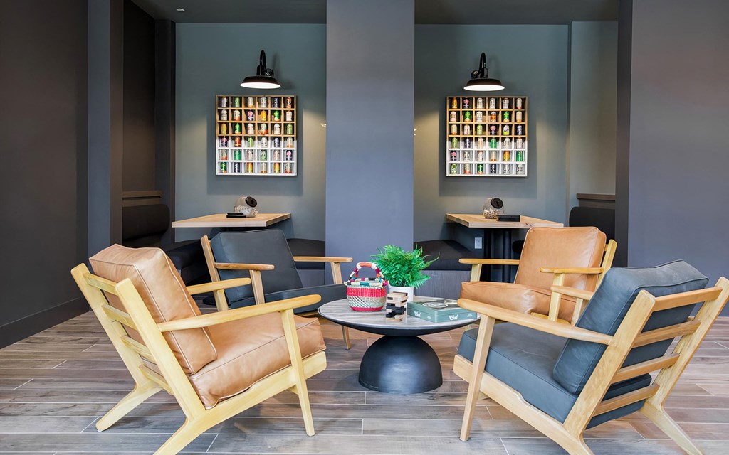 Indoor social area with comfy seating and private booths at Novel Cary