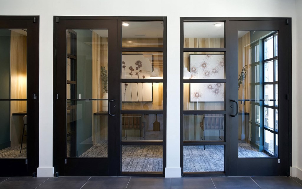 Multiple private office areas with desks and cozy lighting at Novel Cary