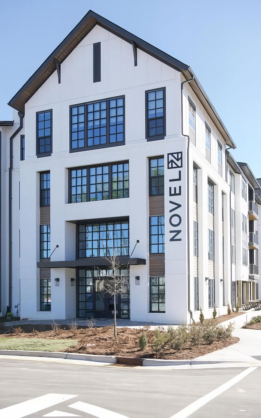 Welcoming farmhouse-style entryway to the apartments at Novel Cary