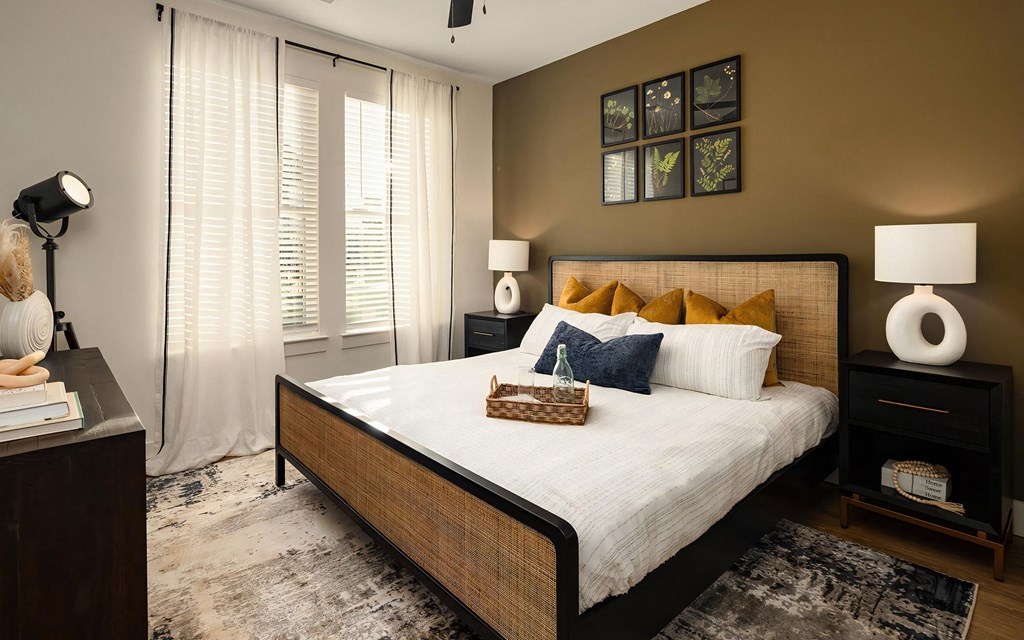 Stylish Bedroom Featuring Woven Bed Frame and Botanical Artwork