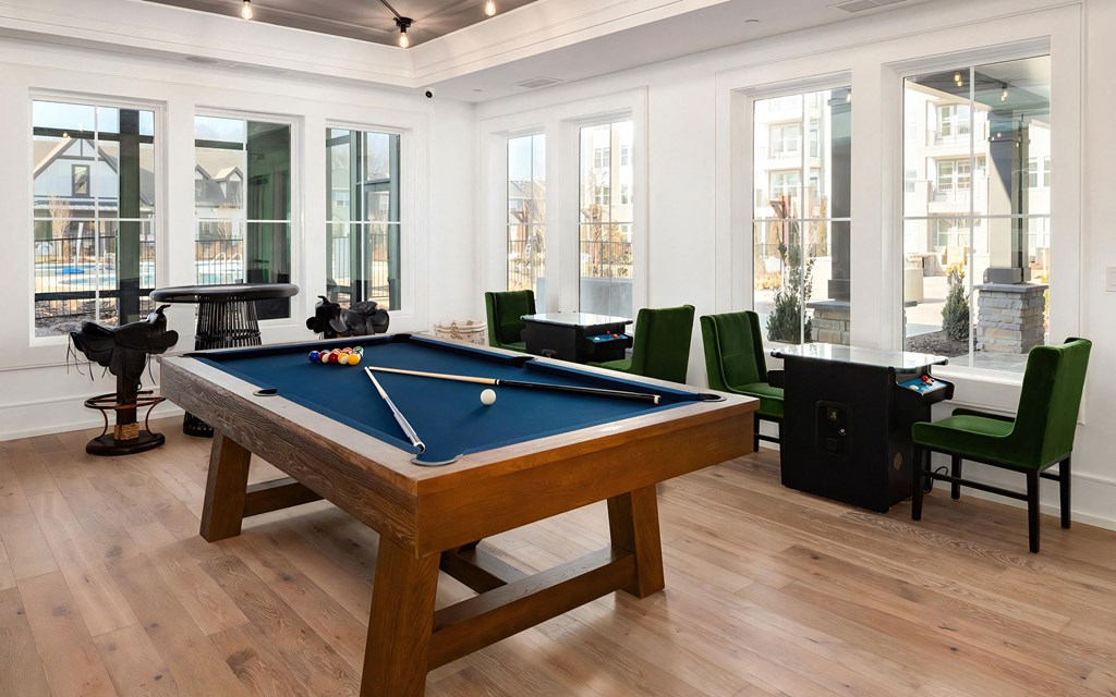 Recreational Game Room with Pool Table and Green Accent Seating