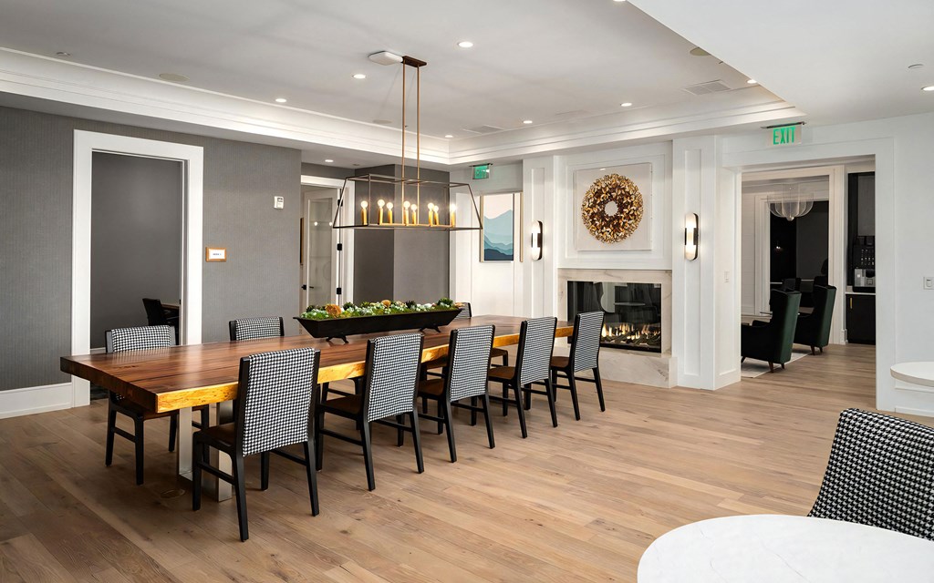 Warm Meeting Space with Fireplace and Long Communal Table