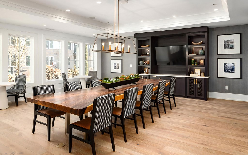 Conference Room with Natural Wood Table and Statement Lighting