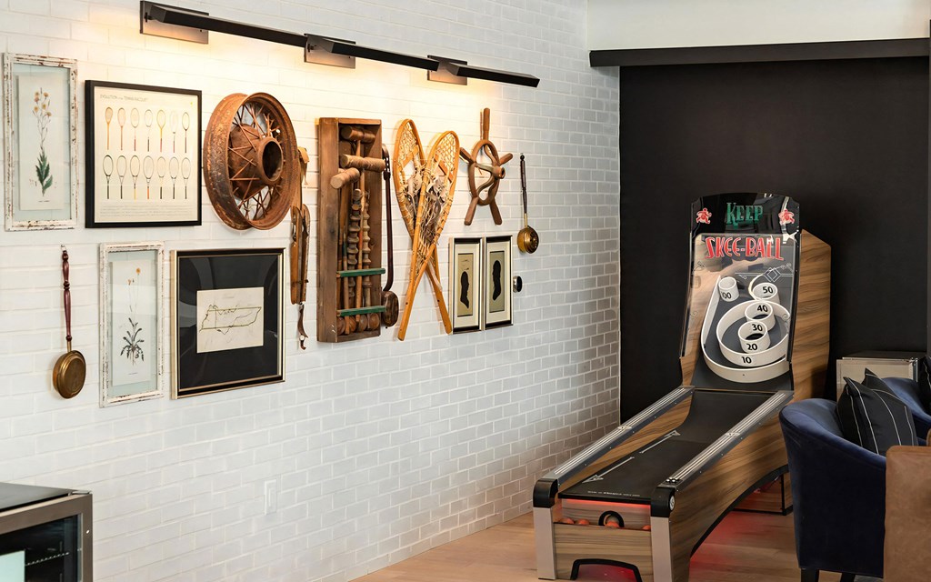 Vintage-Inspired Skee-Ball Game Station with Decorative Wall Art