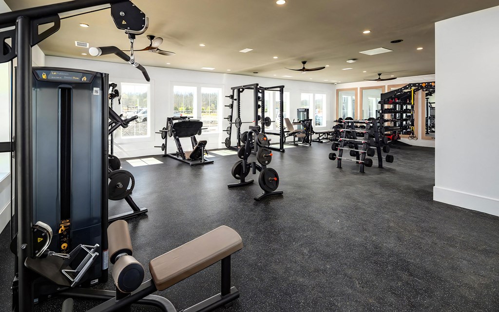 Spacious Fitness Center with Strength Machines, Free Weights, and Mirrors