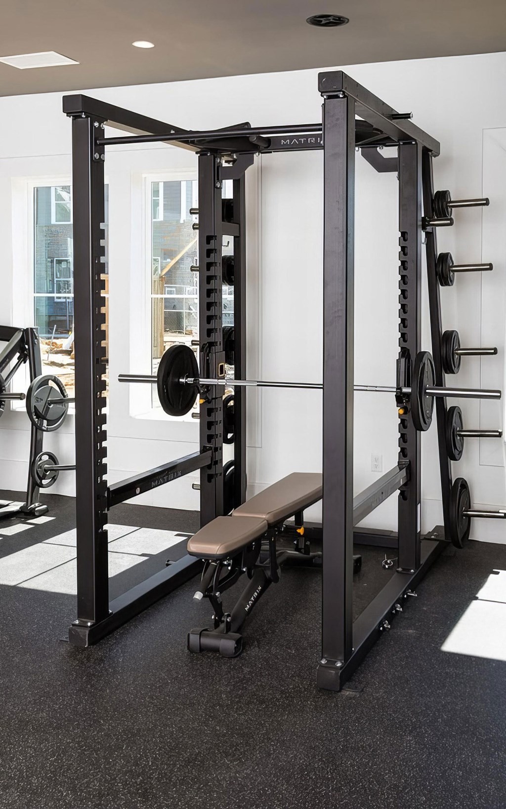 Strength Training Setup with Bench and Barbell in Functional Fitness Room