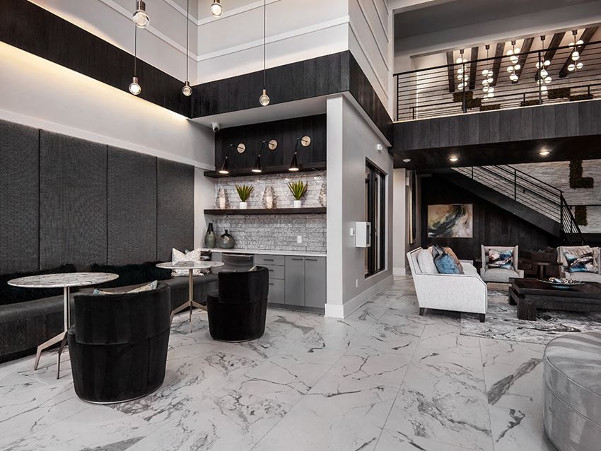a lobby with a living room and a staircase