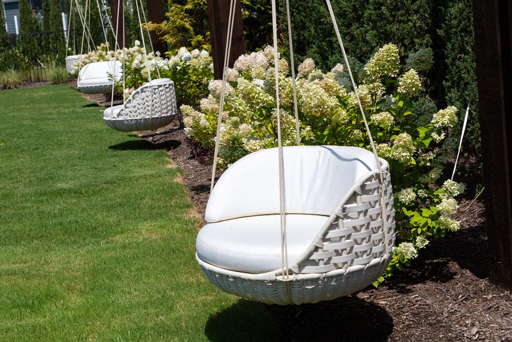 Cozy Hanging Basket Chairs at Harpeth Heights Nestled in Lush Garden Setting