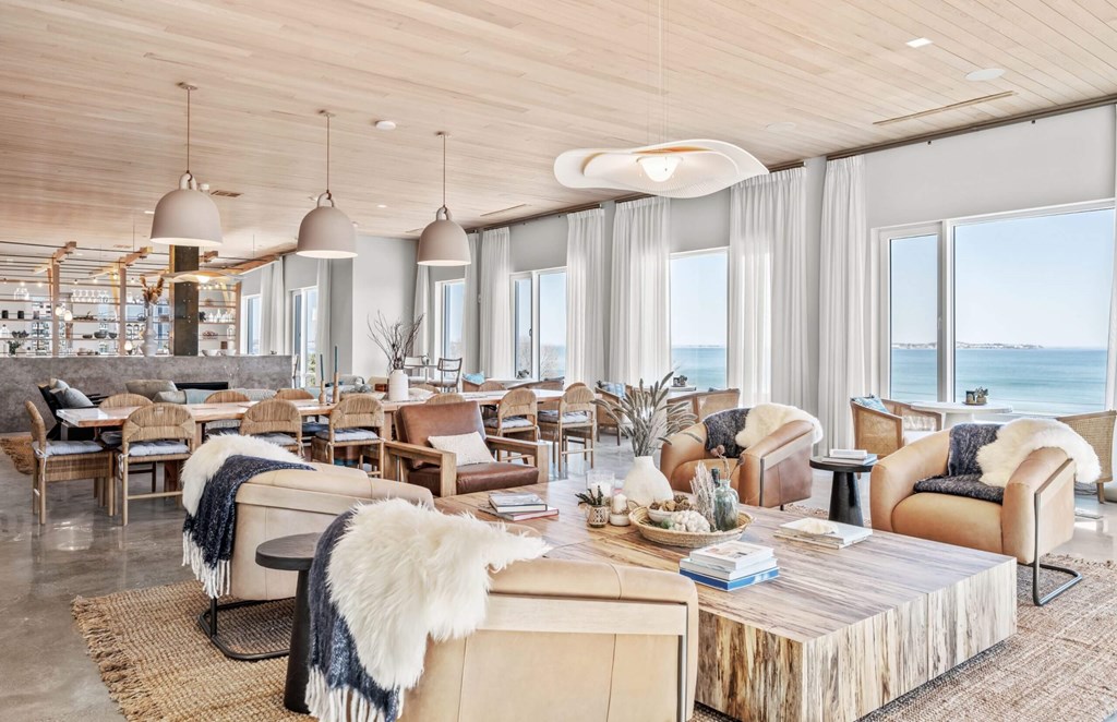 A modern living room with a view of the ocean.
