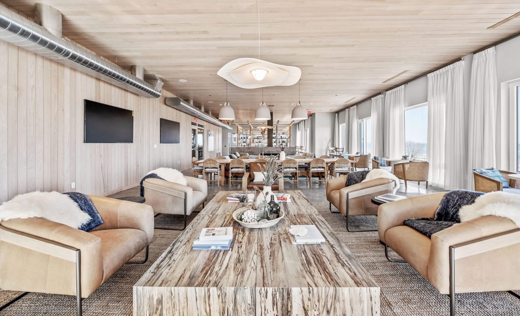 A modern living room with a wooden floor and furniture.