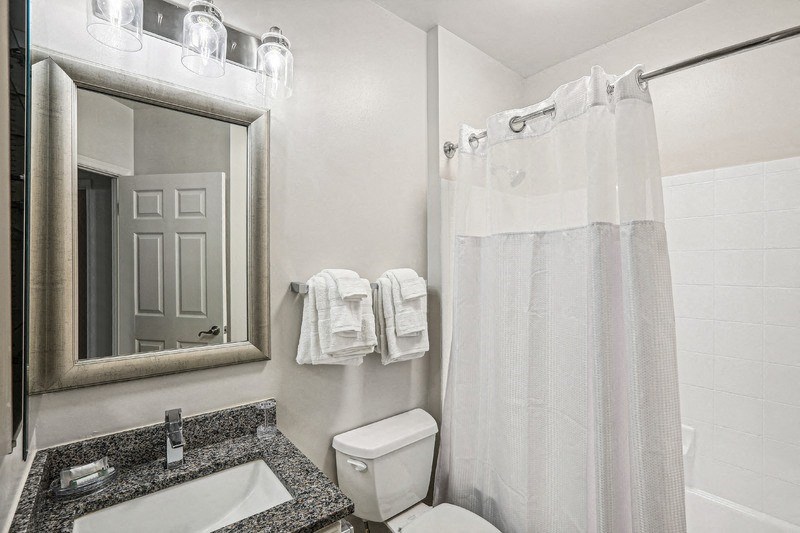Apartment Bathroom Featuring Single Vanity and Overhead Lighting