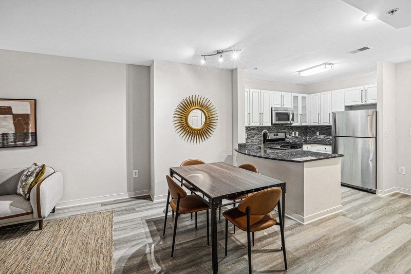 Open Layout Featuring Kitchen with Bar Seating and Dining Table