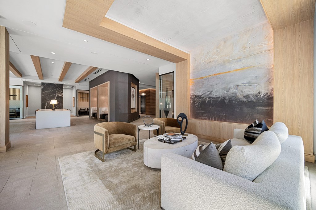 Lobby lounge with curated artwork, plush seating, and refined modern design