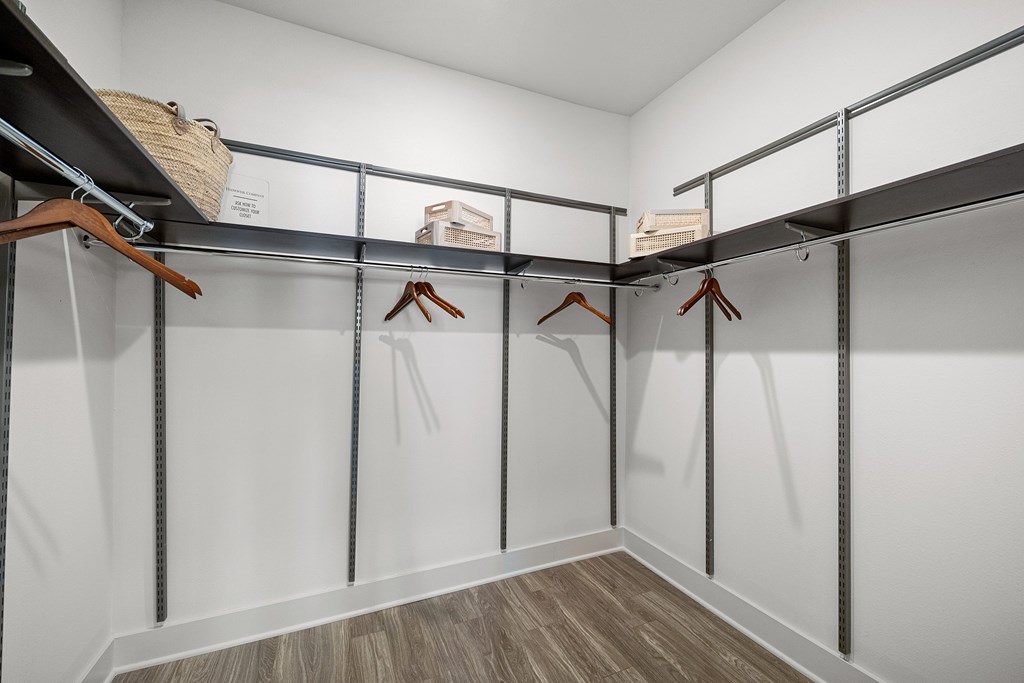Spacious walk-in closet with built-in shelving and plenty of room for organized storage