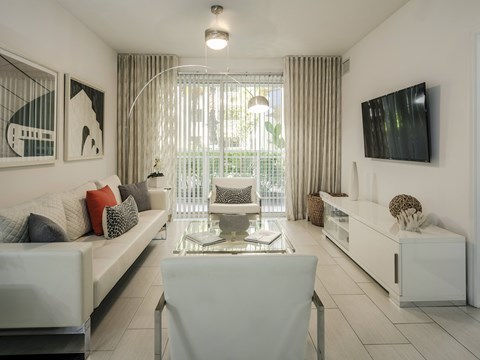 Light-Filled Living Area with Sliding Doors to Private Balcony