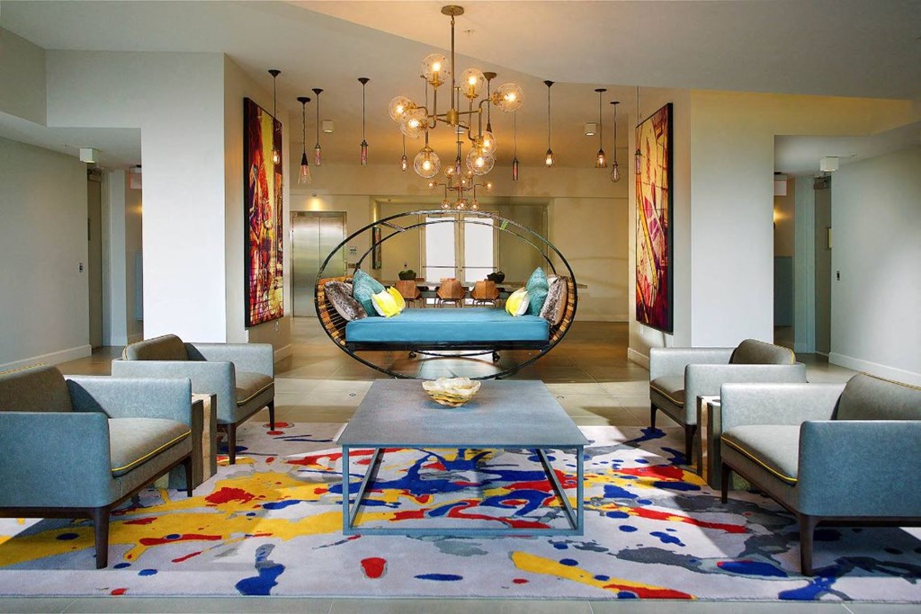 a living room with couches and chairs and a table