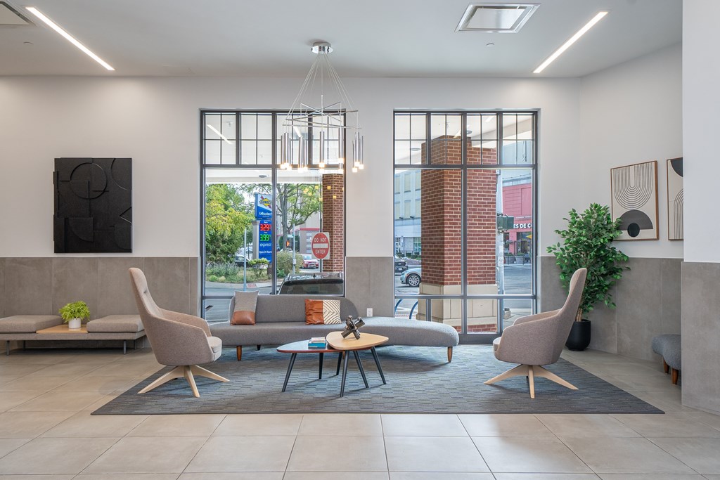 A modern waiting room with a view of the street outside.