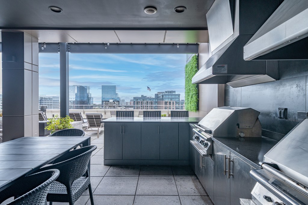 A modern kitchen with a view of the city.