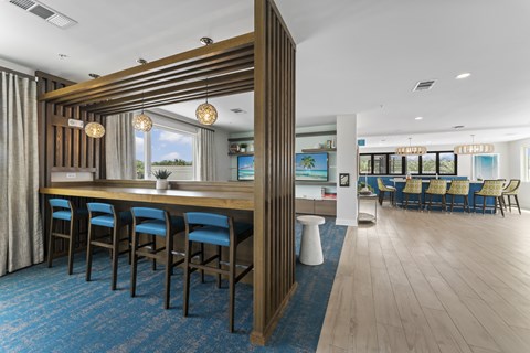 A dining area with a long table and chairs.