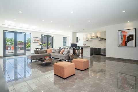 A modern living room with a grey sofa and a coffee table.