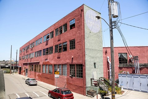 A red building with a sign that says 100 tons.