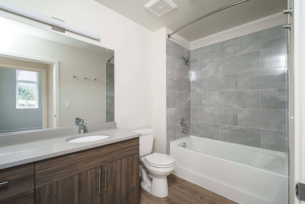a bathroom with a sink toilet and a bath tub