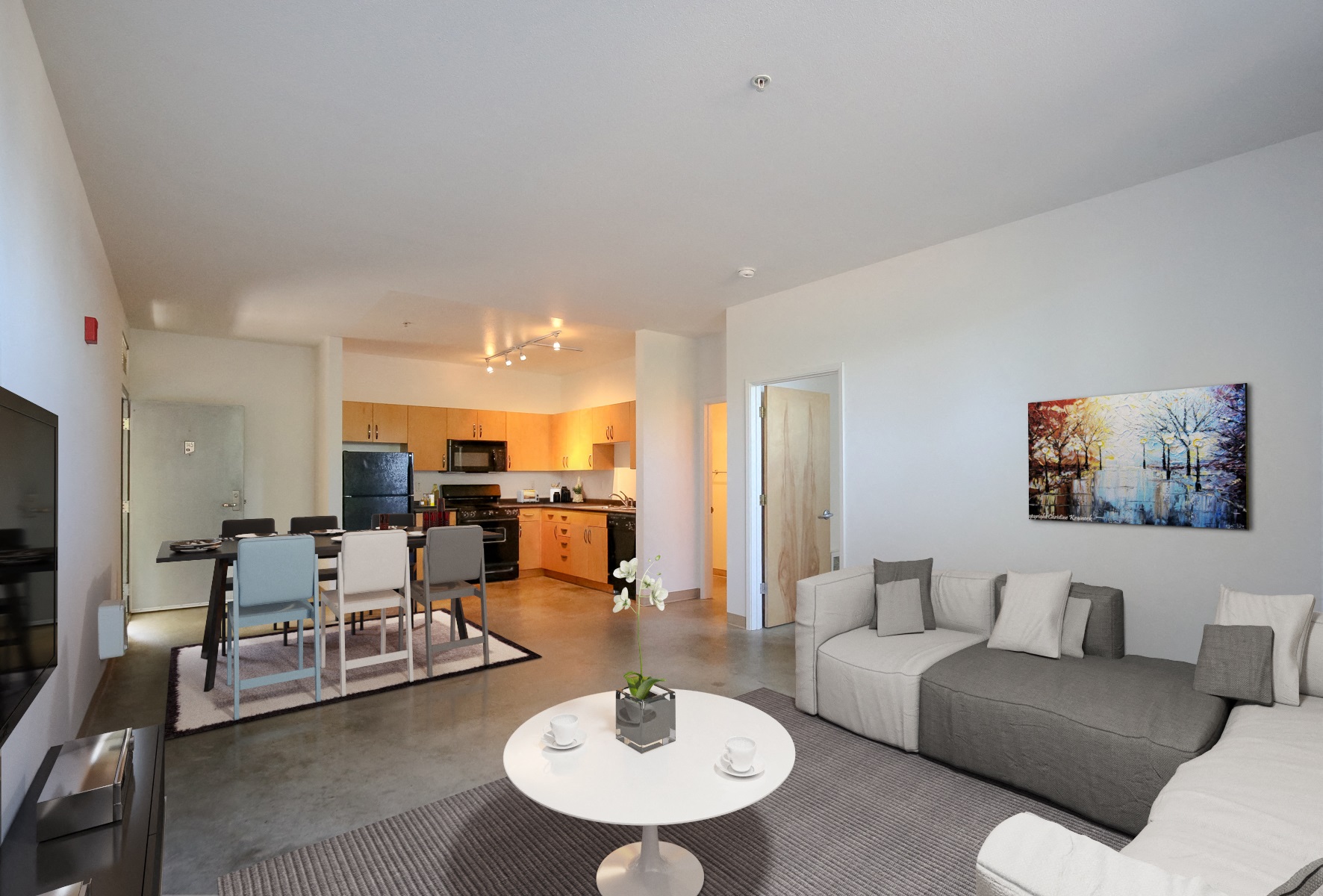 a living room and dining room with a couch and a table