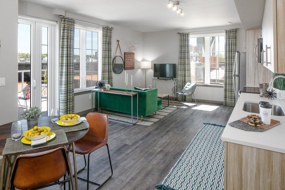 Staged interior with view of dining and living
