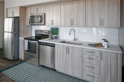 a kitchen with stainless steel appliances and a sink