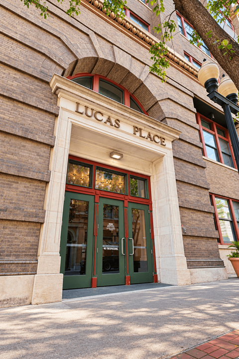 The Lucas Place building has a green door and window frames.
