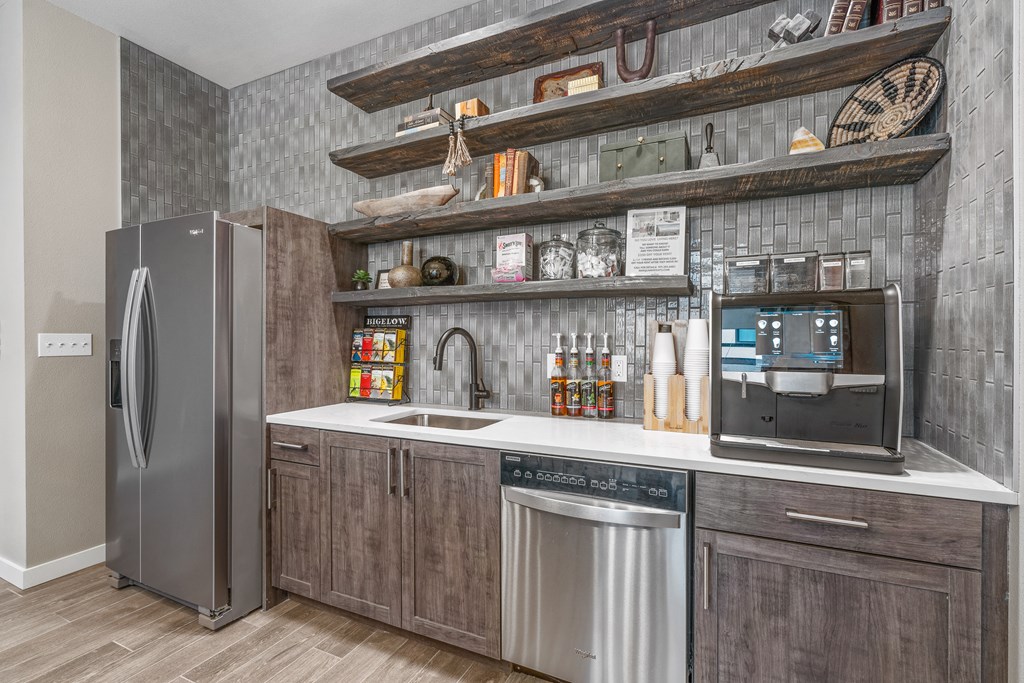 a kitchen with wooden cabinets and stainless steel appliances