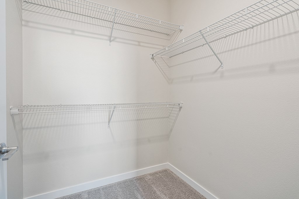a walk in closet in a 555 waverly unit