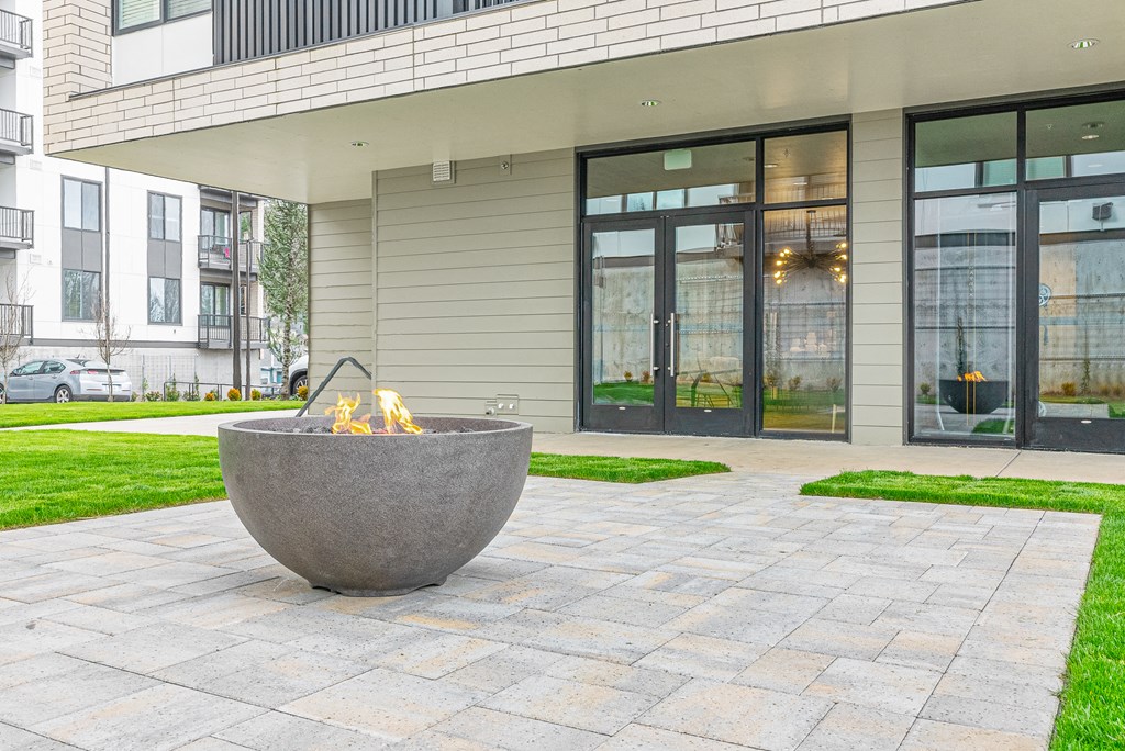 a fire pit in front of a building