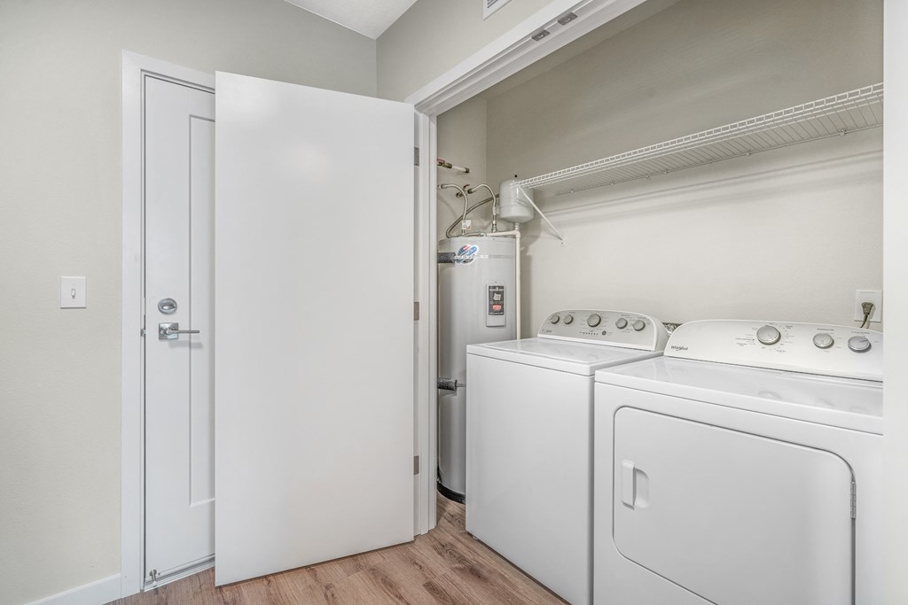 a laundry room with a washer and dryer