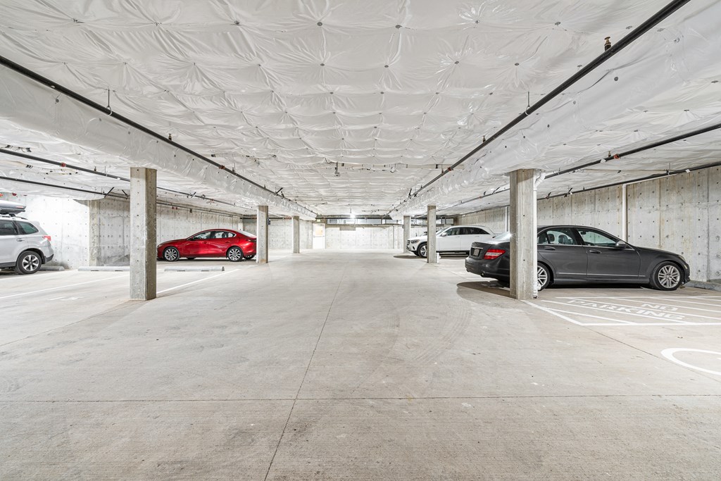a parking garage with cars in it