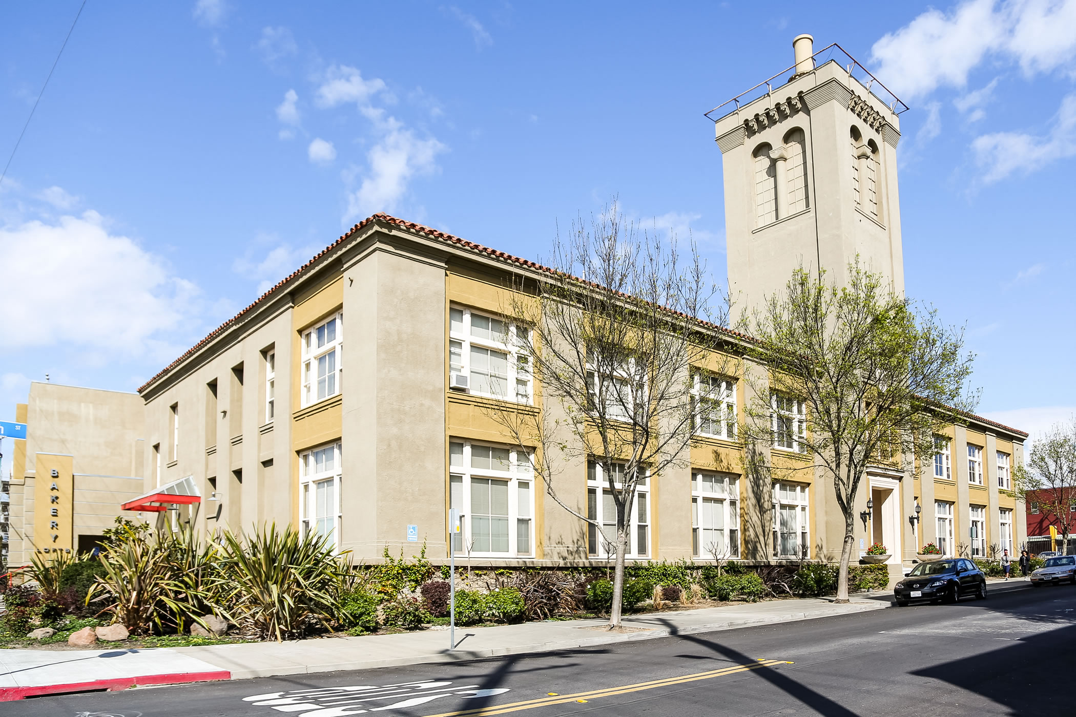 Bakery Lofts exterior ground level view form Adeline and 47th street corner