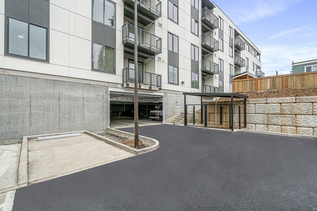 a view of the entrance to the building from the parking lot