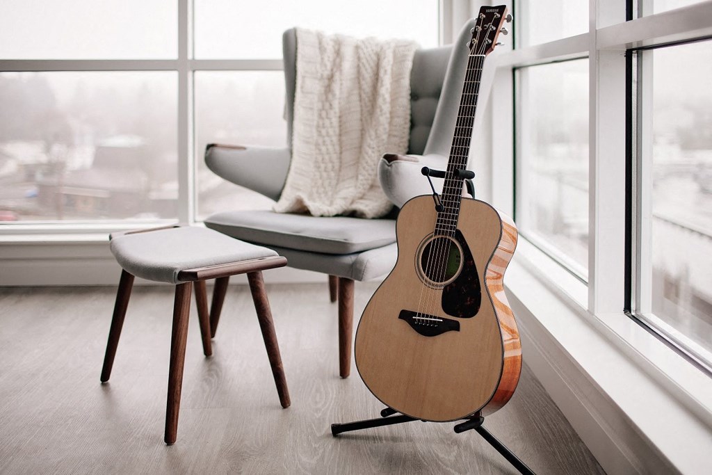 staged decor close up: chair and guitar