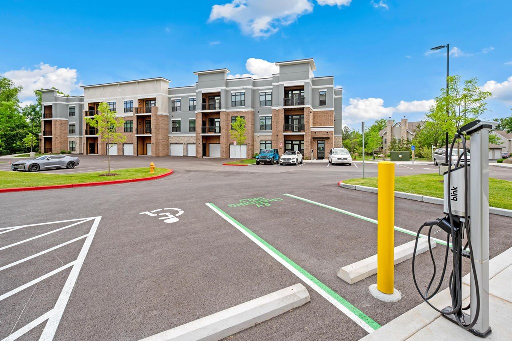 A parking lot with a charging station for electric vehicles.