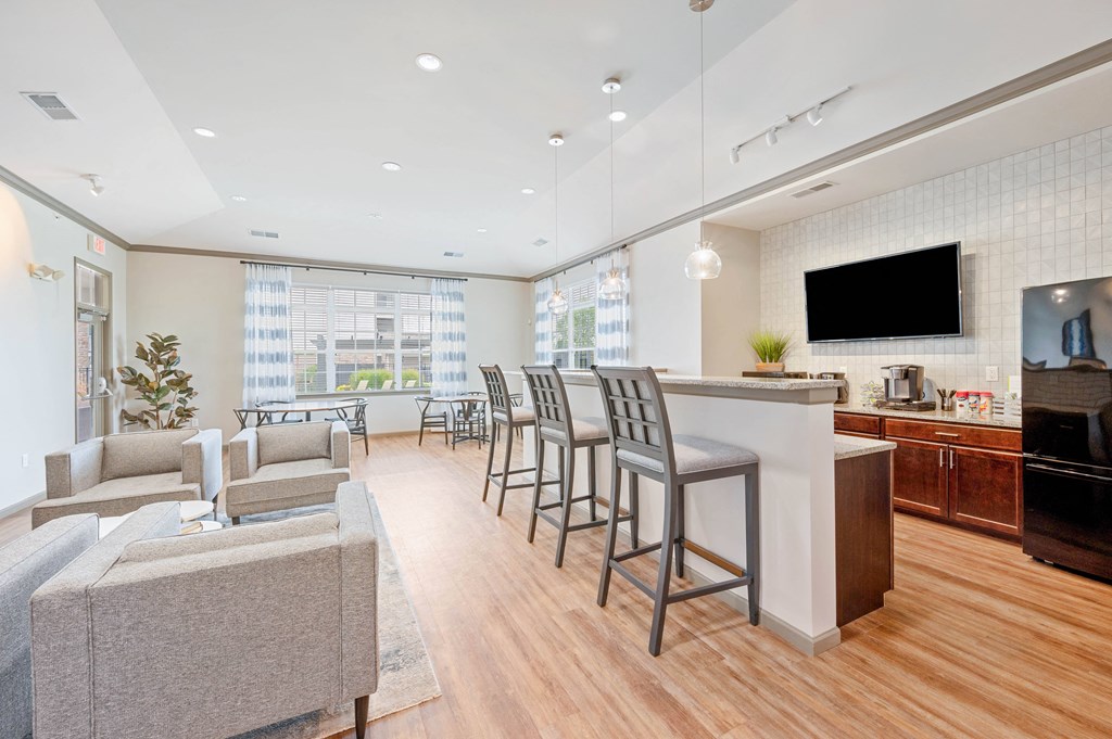 a living room with white walls and hardwood flooring