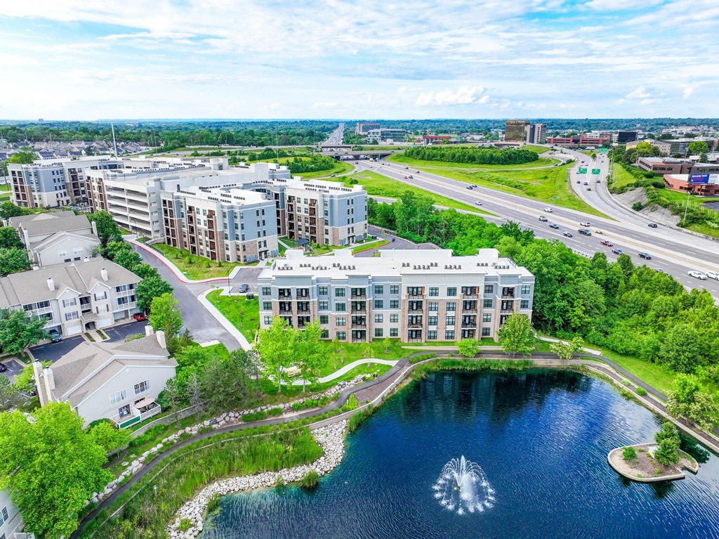A large building with a fountain in front of it.