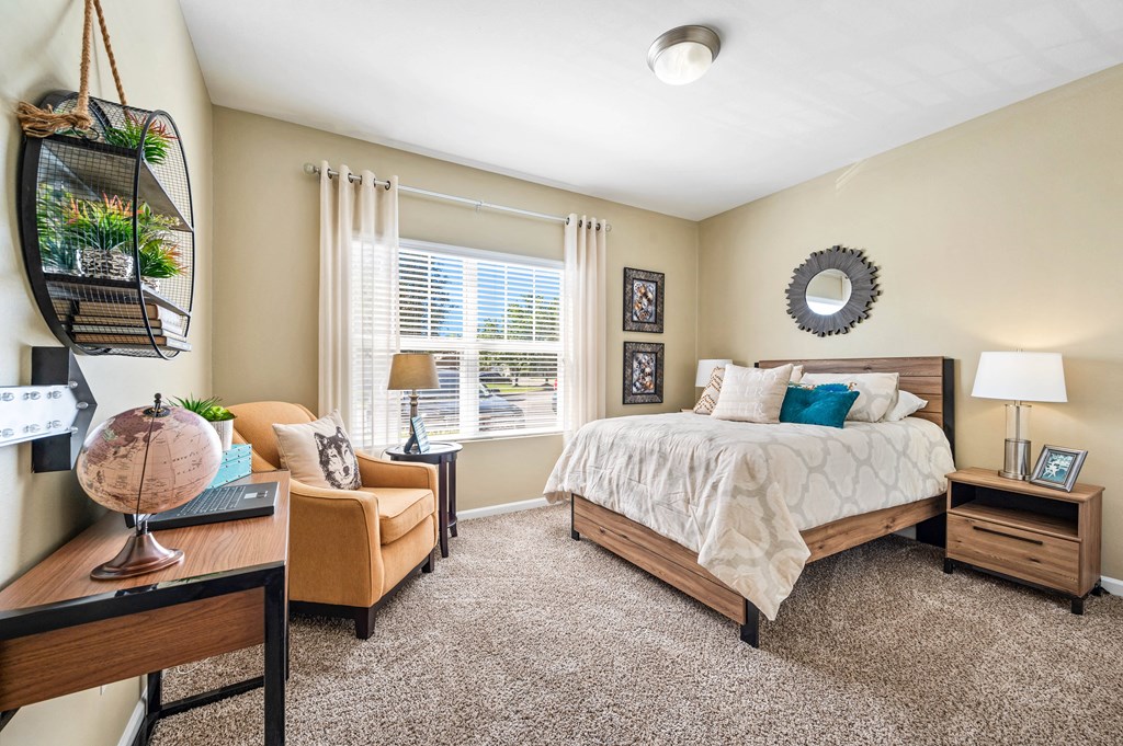 a bedroom with a large bed and a window