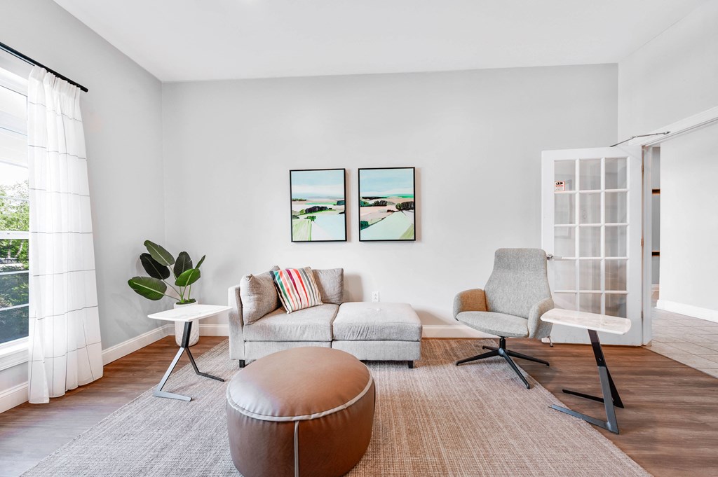 a living room with a couch and two chairs