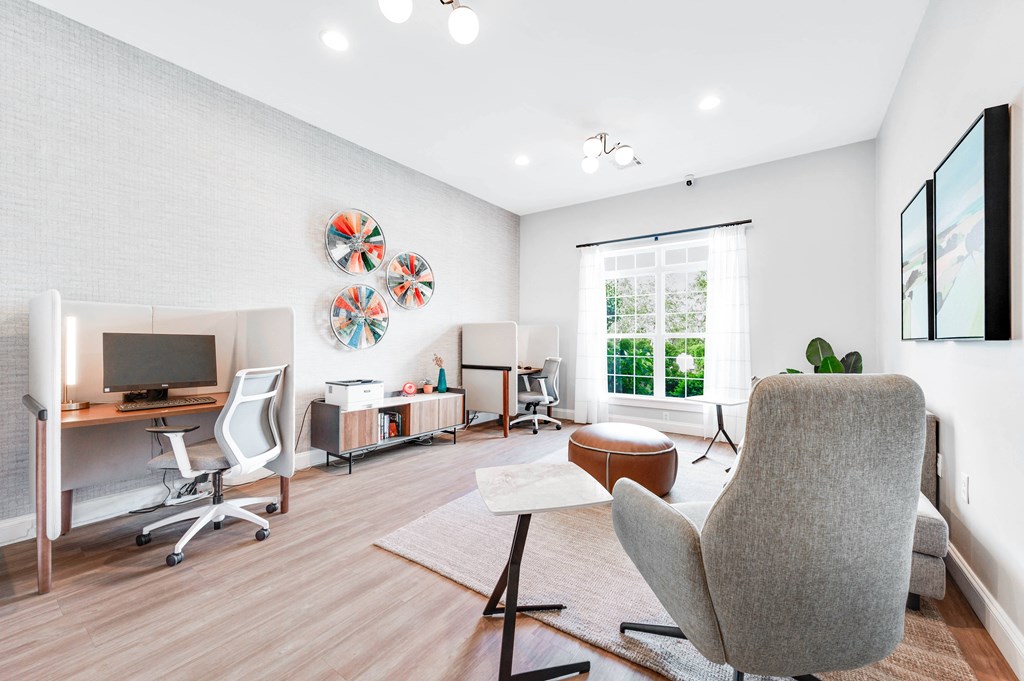a living room with white walls and hardwood flooring